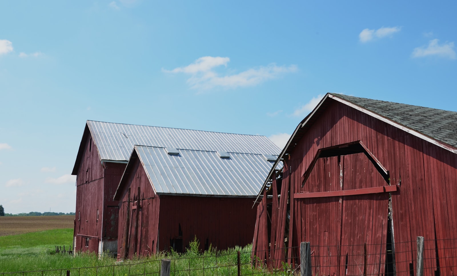 A post-frame building with a metal roof on a rural lot